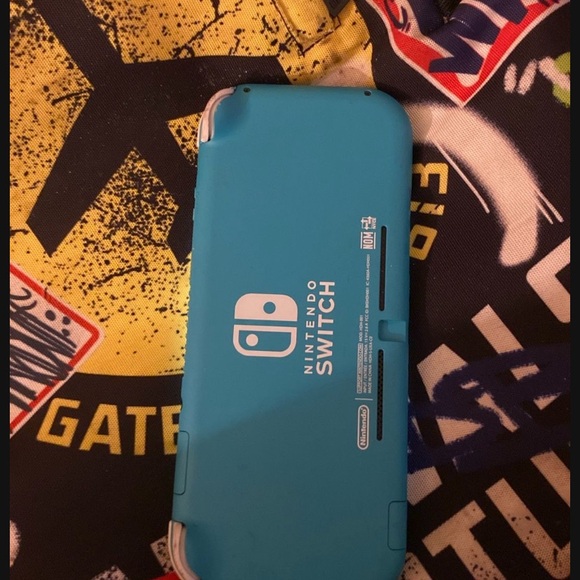 Nintendo Switch Lite in Teal - Picture 1 of 3